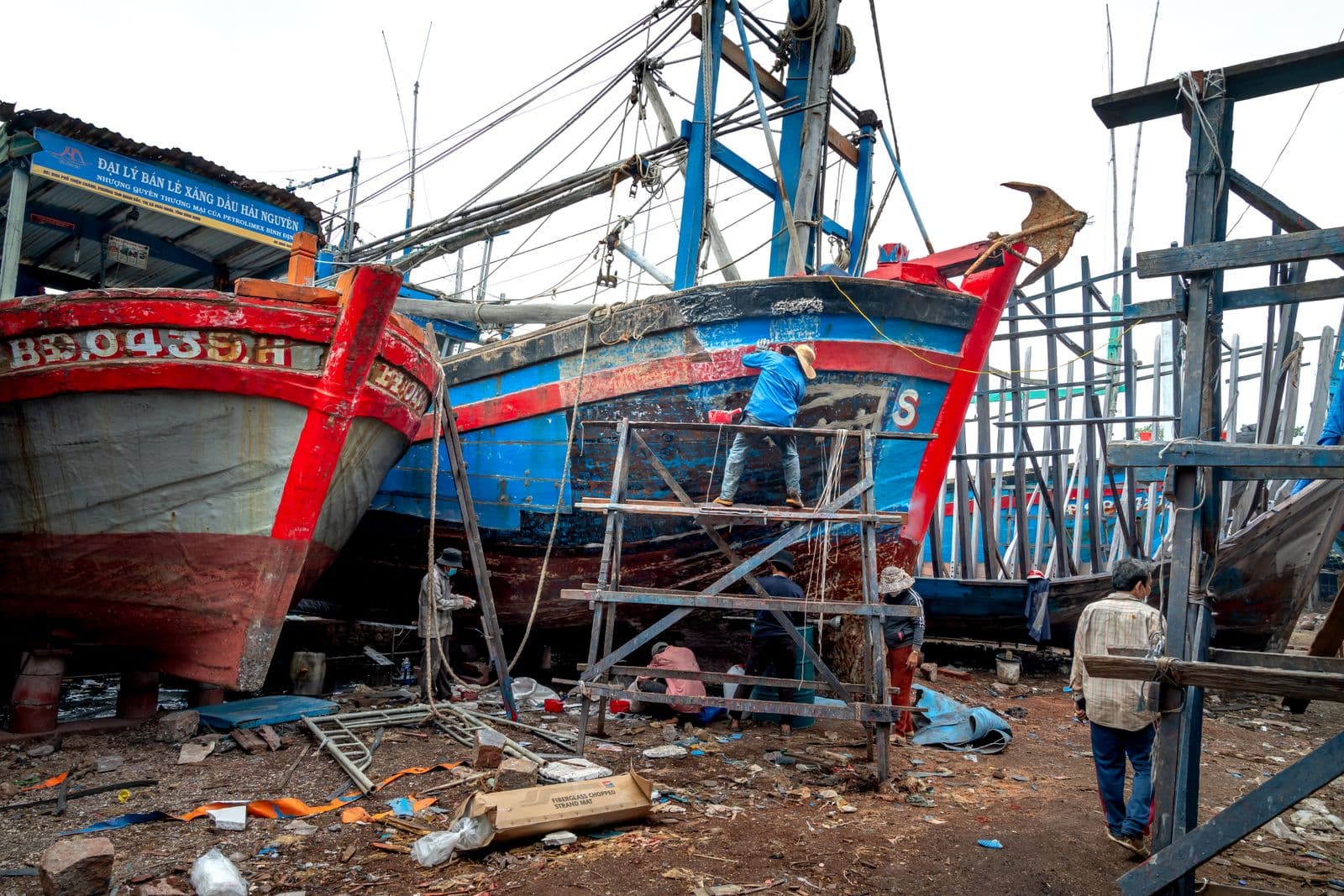 Boats undergoing maintenance at a shipyard